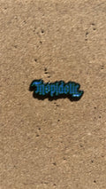 Pin: Tropidelic - Ambigram Logo